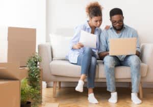 stock photo of a couple looking at a laptop
