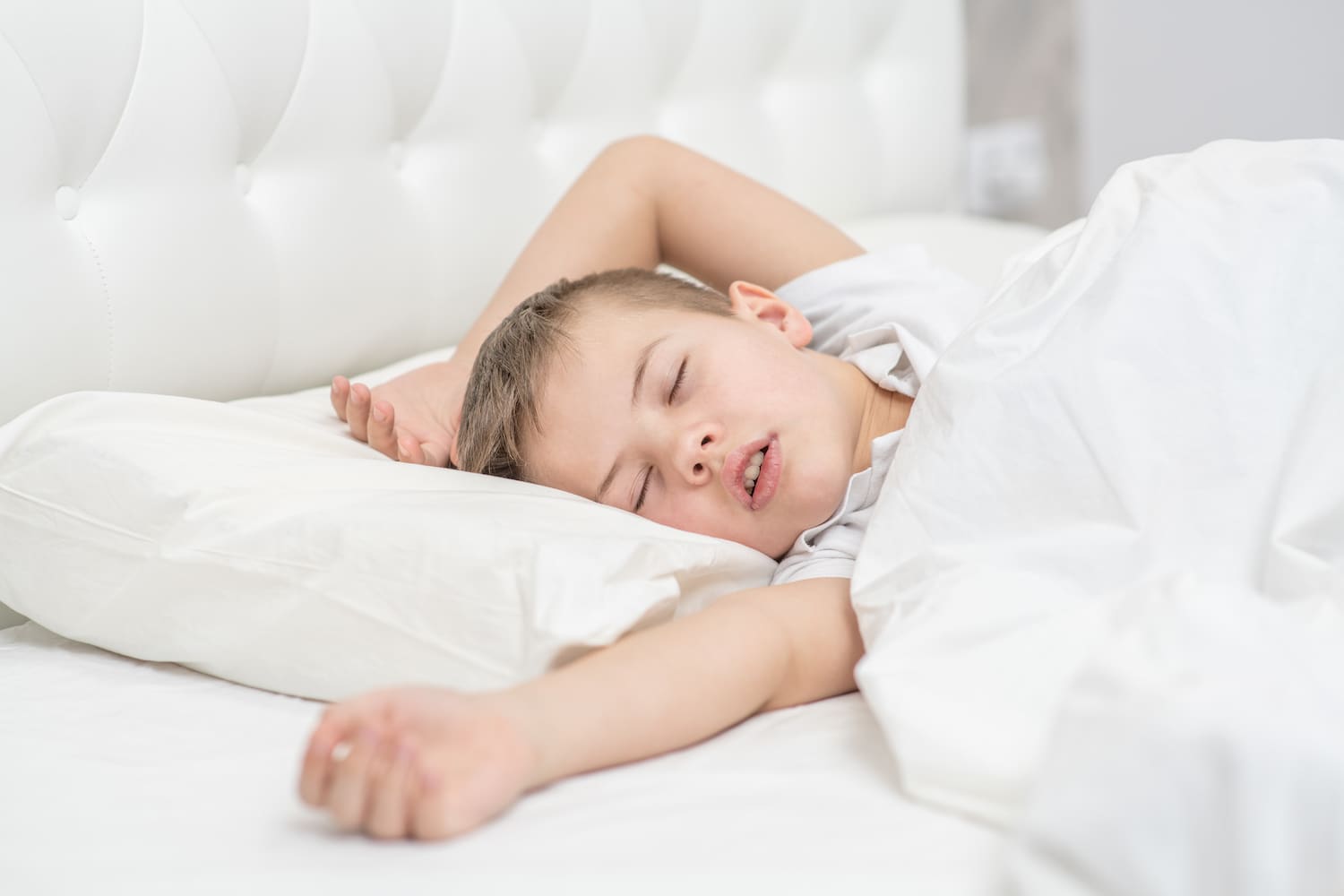 Young boy is sleeping and snoring