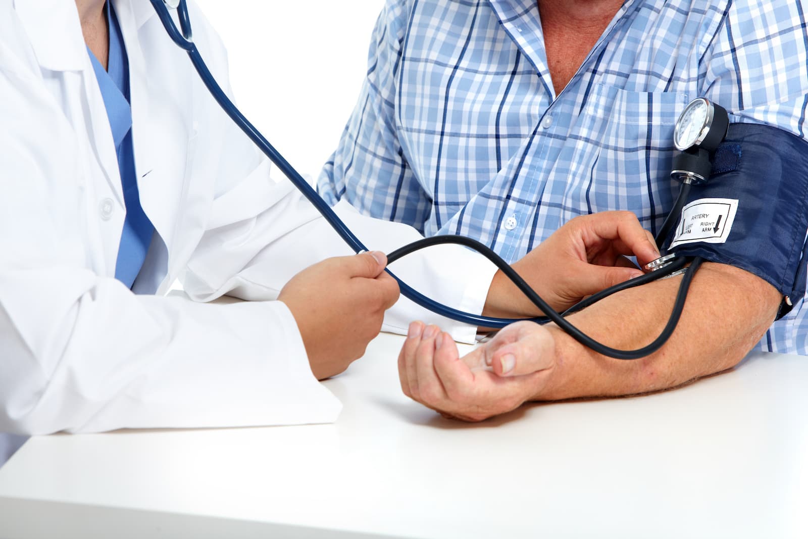 A doctor checks a person's blood pressure