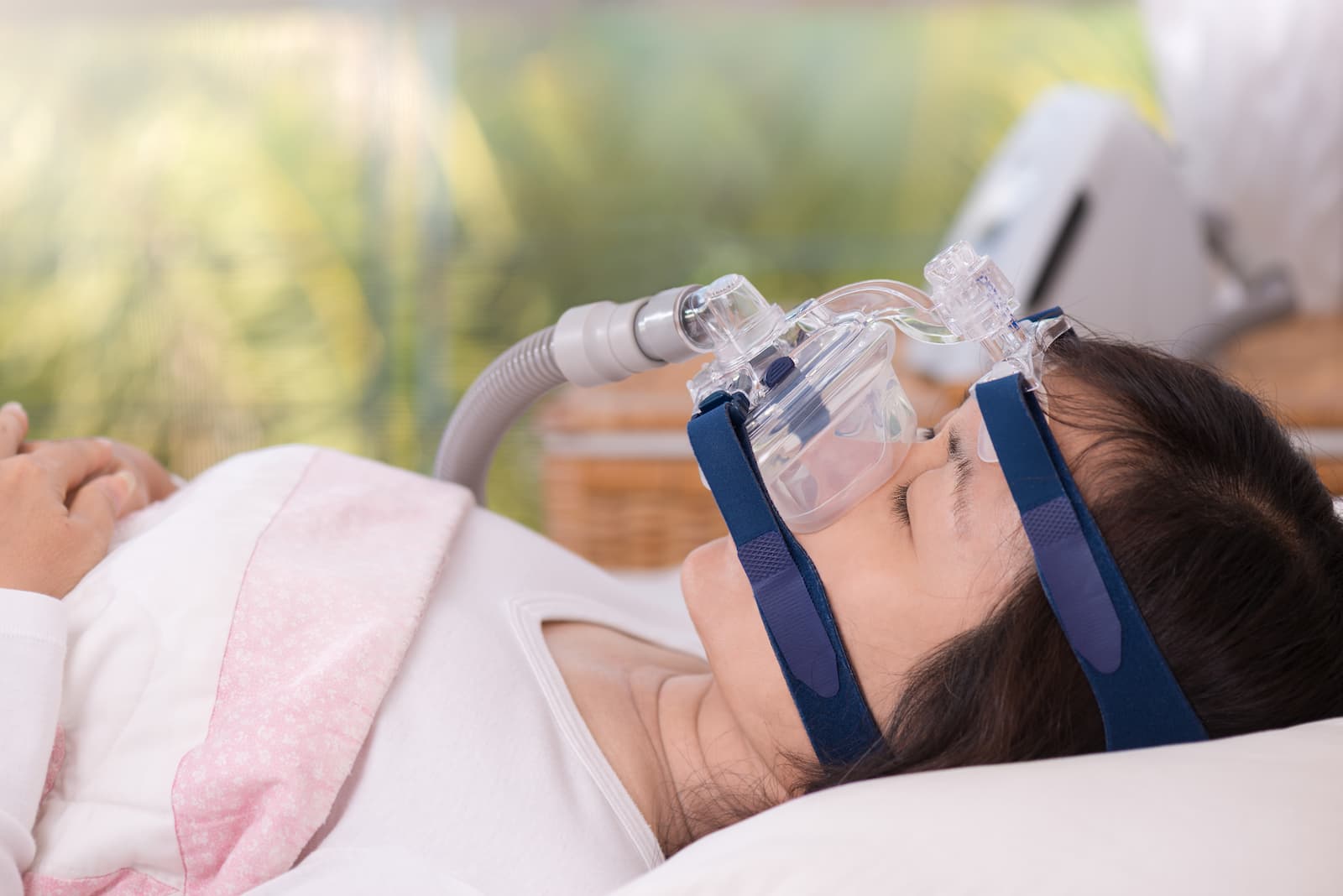 person wearing a sleep apnea mask