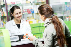 person making a purchase at a pharmacy