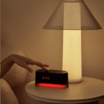 Loftie clock on nightstand with lamp