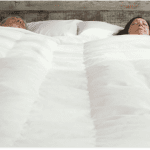couple sleeping under BedJet Cloud Sheet