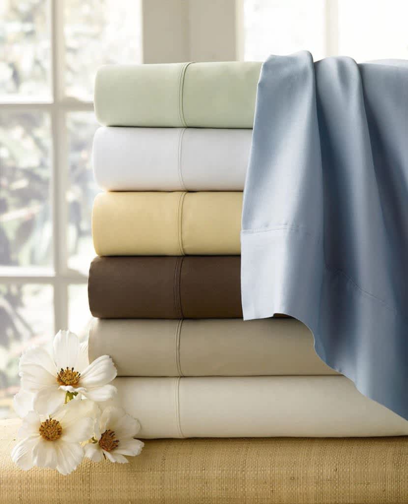 different colored Luxor Linens Adriana Sateen Egyptian Sheets folded neatly on top of each other